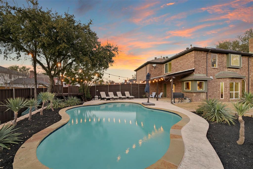6821 Rochelle Drive Plano, TX 75023 - Photo 1 of 36 a view of a swimming pool with a patio
