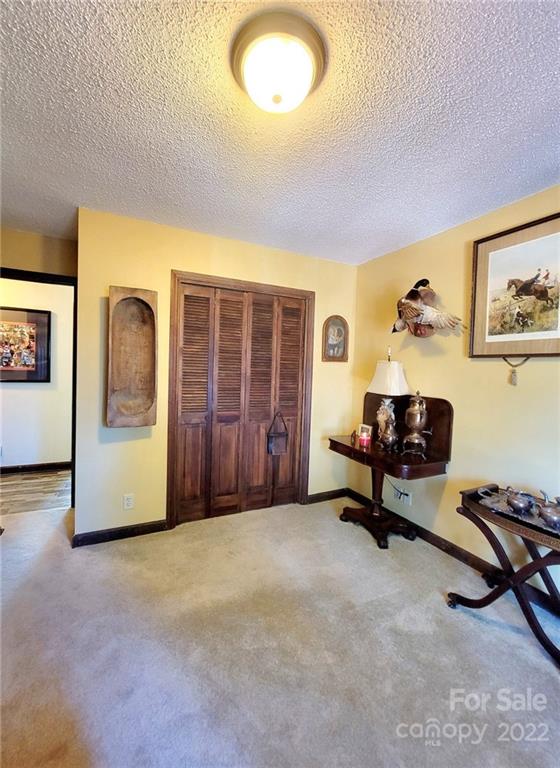 2211 Camden Road Wingate, NC 28174 - Photo 4 of 21 a living room with furniture gym equipment and a window