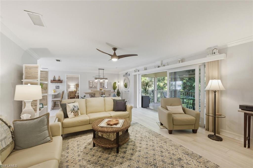 500 Teryl Road, Unit 2312 Naples, FL 34112 - Photo 11 of 46 Living area featuring ornamental molding, a ceiling fan, and light wood-style floors