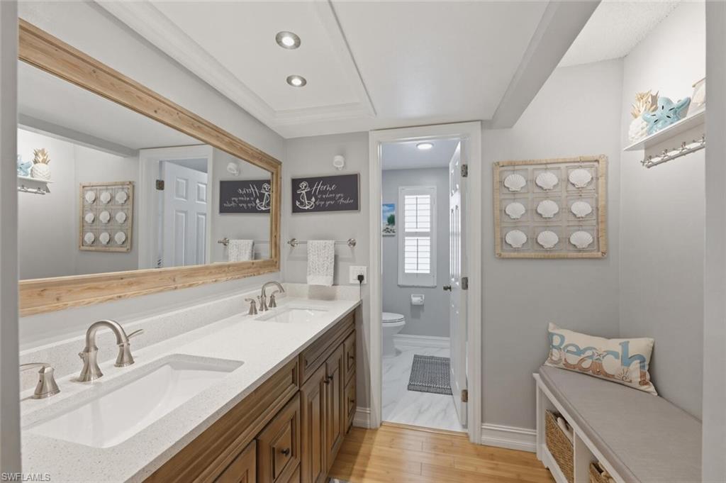 500 Teryl Road, Unit 2312 Naples, FL 34112 - Photo 20 of 46 Full master bathroom with double vanity, recessed lighting, and light wood-type flooring