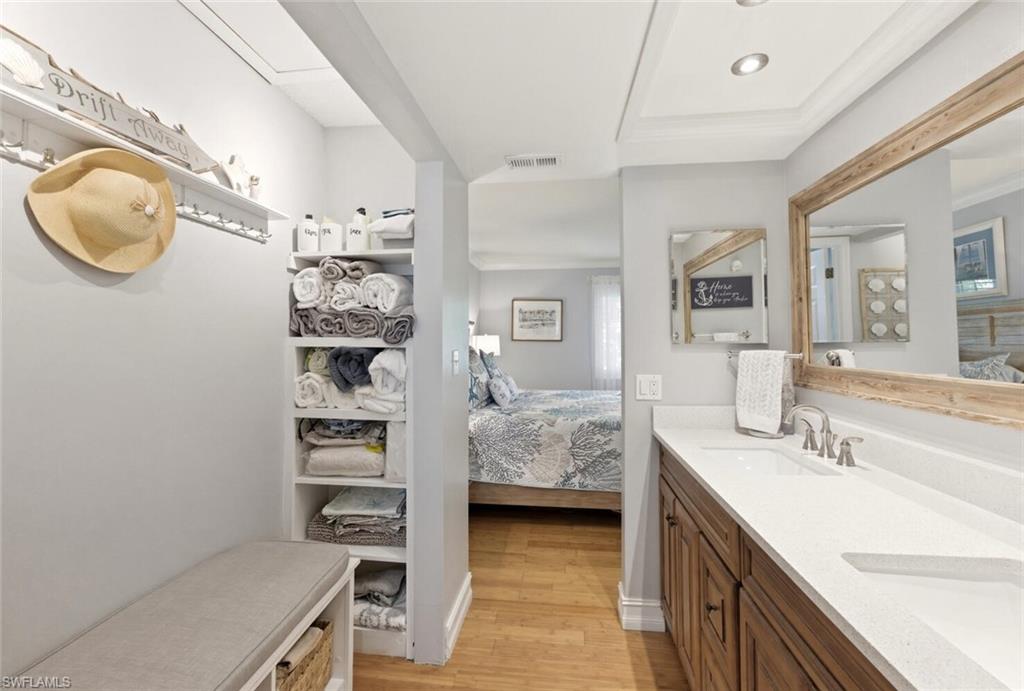 500 Teryl Road, Unit 2312 Naples, FL 34112 - Photo 21 of 46 Ensuite master bathroom featuring double vanity and light wood finished floors