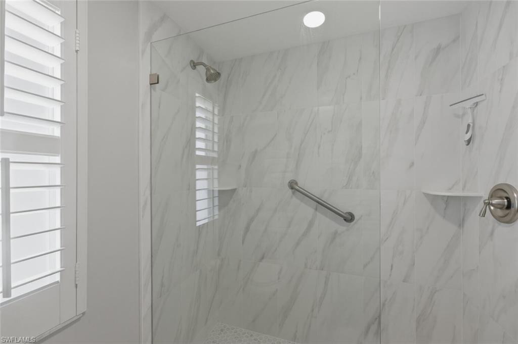 500 Teryl Road, Unit 2312 Naples, FL 34112 - Photo 22 of 46 Full master bathroom featuring plenty of natural light and a marble finish shower
