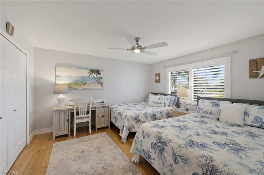 500 Teryl Road, Unit 2312 Naples, FL 34112 - Photo 23 of 46 Guest Bedroom with a closet, light wood-type flooring, and ceiling fan