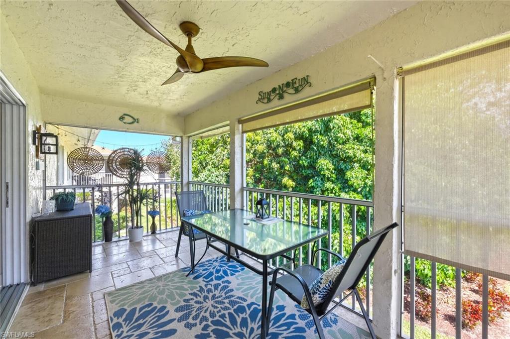 500 Teryl Road, Unit 2312 Naples, FL 34112 - Photo 28 of 46 Sunroom featuring ceiling fan, outdoor dining area, and a balcony