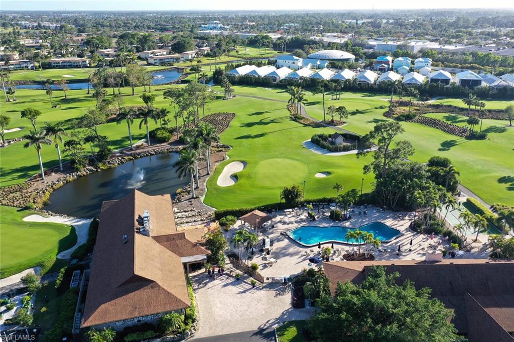 500 Teryl Road, Unit 2312 Naples, FL 34112 - Photo 31 of 46 Aerial view of residential area with a local golf course and a nearby body of water