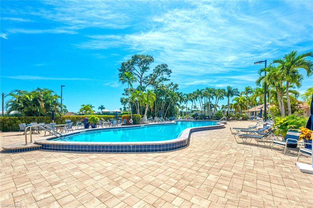 500 Teryl Road, Unit 2312 Naples, FL 34112 - Photo 34 of 46 Community pool featuring a patio