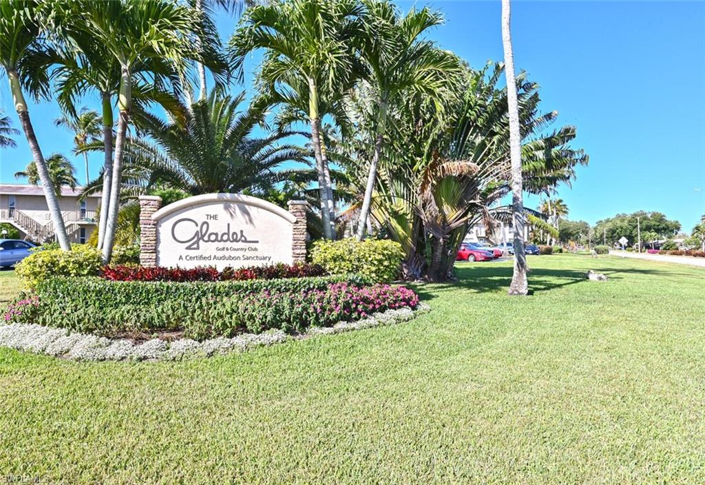 500 Teryl Road, Unit 2312 Naples, FL 34112 - Photo 46 of 46 Community sign featuring a lawn