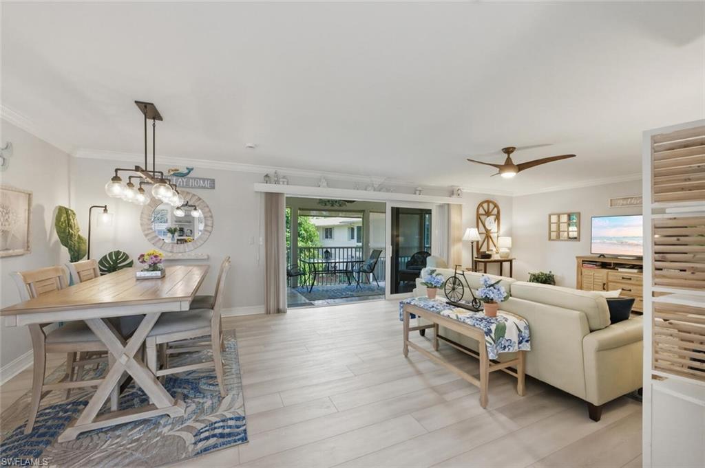 500 Teryl Road, Unit 2312 Naples, FL 34112 - Photo 6 of 46 Living area with light wood-style flooring, crown molding, and a ceiling fan
