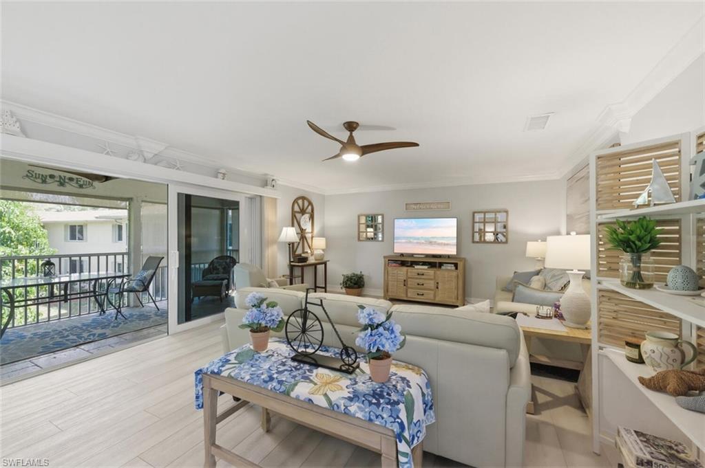 500 Teryl Road, Unit 2312 Naples, FL 34112 - Photo 8 of 46 Living area featuring a ceiling fan, light wood-type flooring, and ornamental molding
