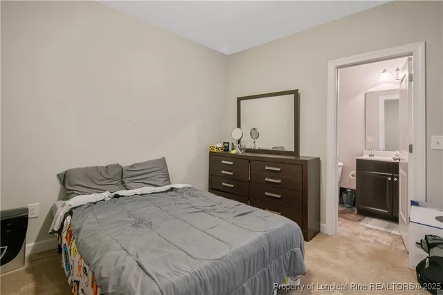 a bedroom with a bed and a dresser