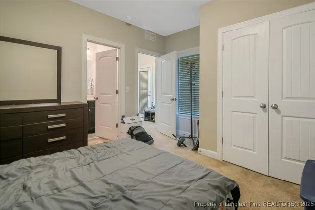 a bathroom with a sink a toilet and shower curtain