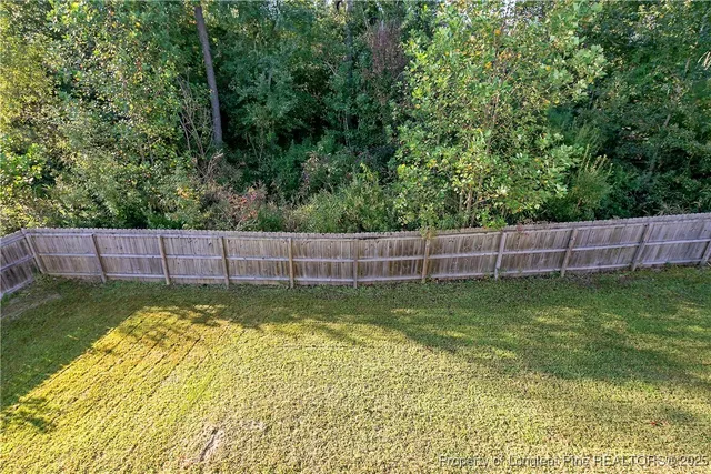 an aerial view of a house with swimming pool