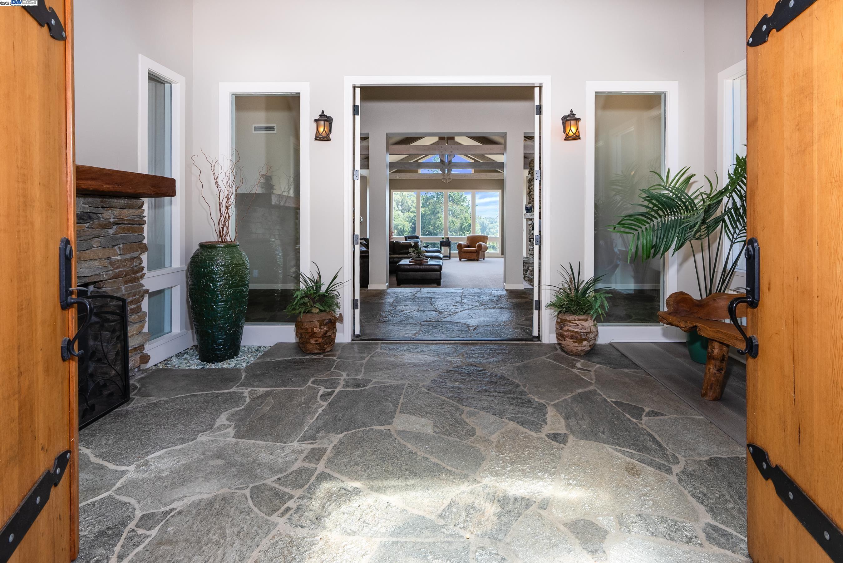 905 Moon Valley Ranch Road Watsonville, CA 95076 - Photo 15 of 60 a living room with furniture and a fireplace