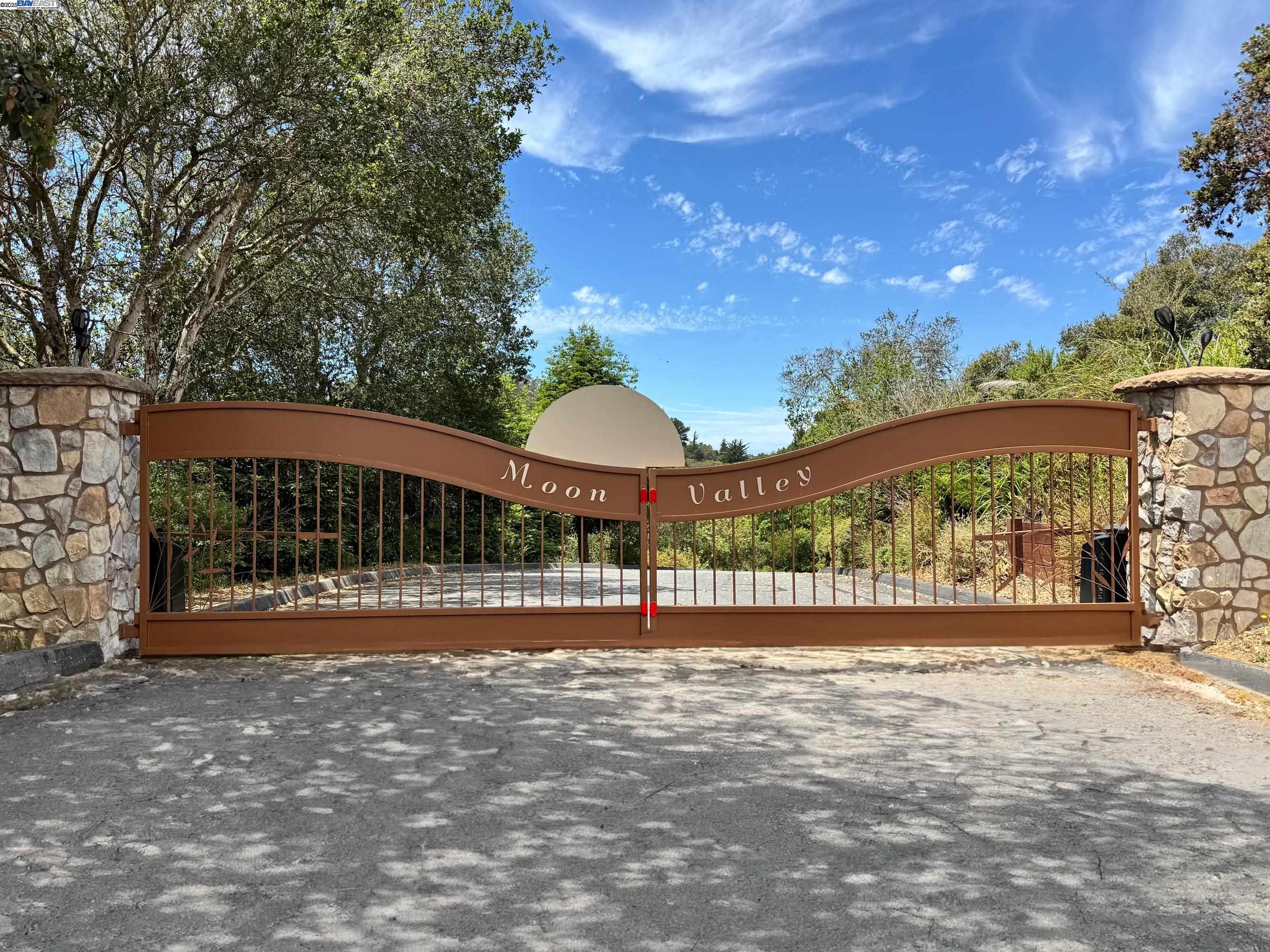 905 Moon Valley Ranch Road Watsonville, CA 95076 - Photo 2 of 60 a backyard of a house with lots of green space and fountain