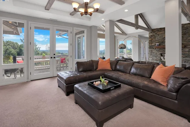 a kitchen with stainless steel appliances granite countertop a stove a chimney and a fireplace