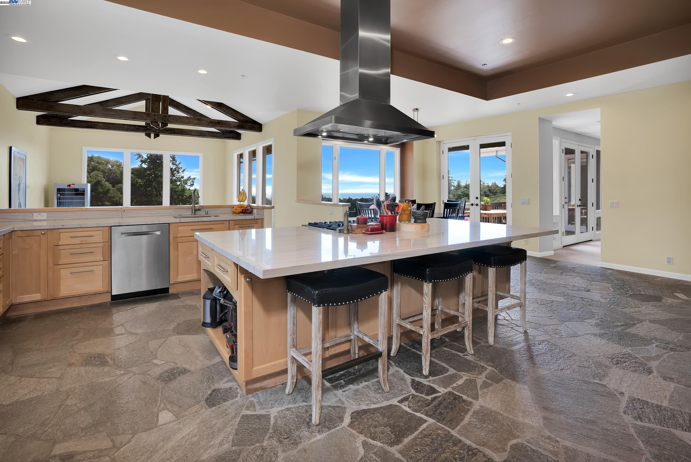 905 Moon Valley Ranch Road Watsonville, CA 95076 - Photo 27 of 60 a open kitchen with a table and chairs in it