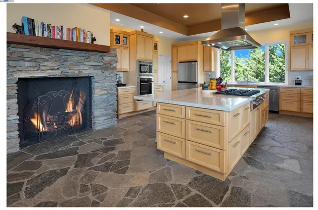 a view of a patio with table and chairs with wooden floor and fence