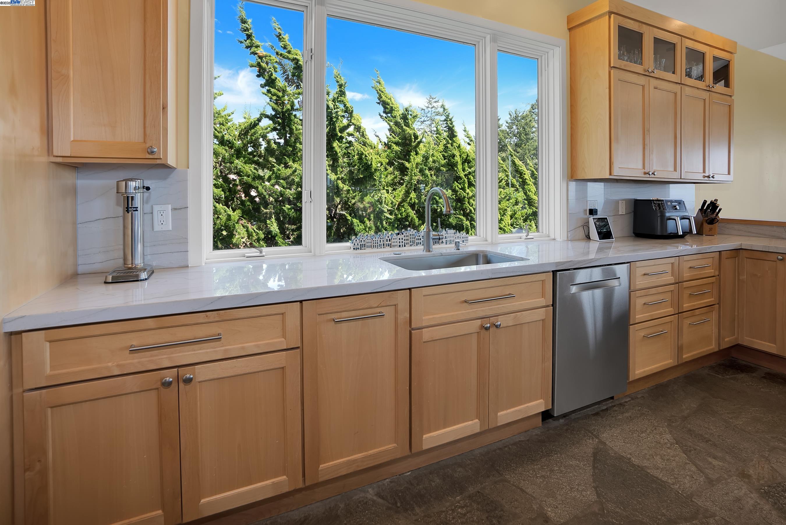 905 Moon Valley Ranch Road Watsonville, CA 95076 - Photo 30 of 60 a kitchen with appliances cabinets and a potted plant