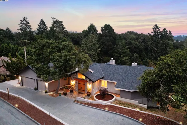 an aerial view of a house with outdoor space