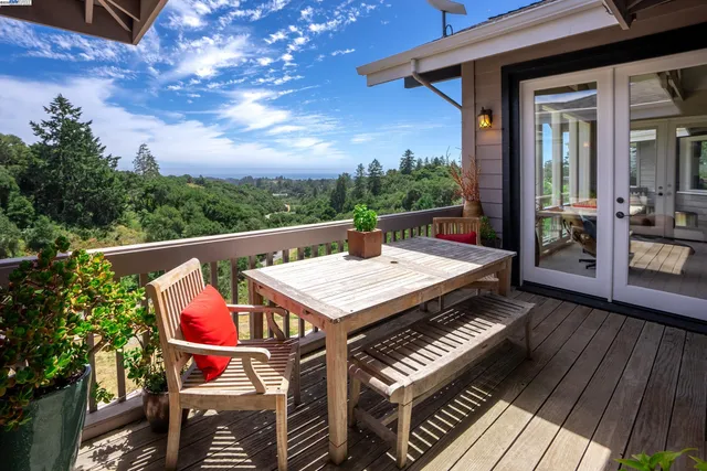 a large living room with a large window and front door