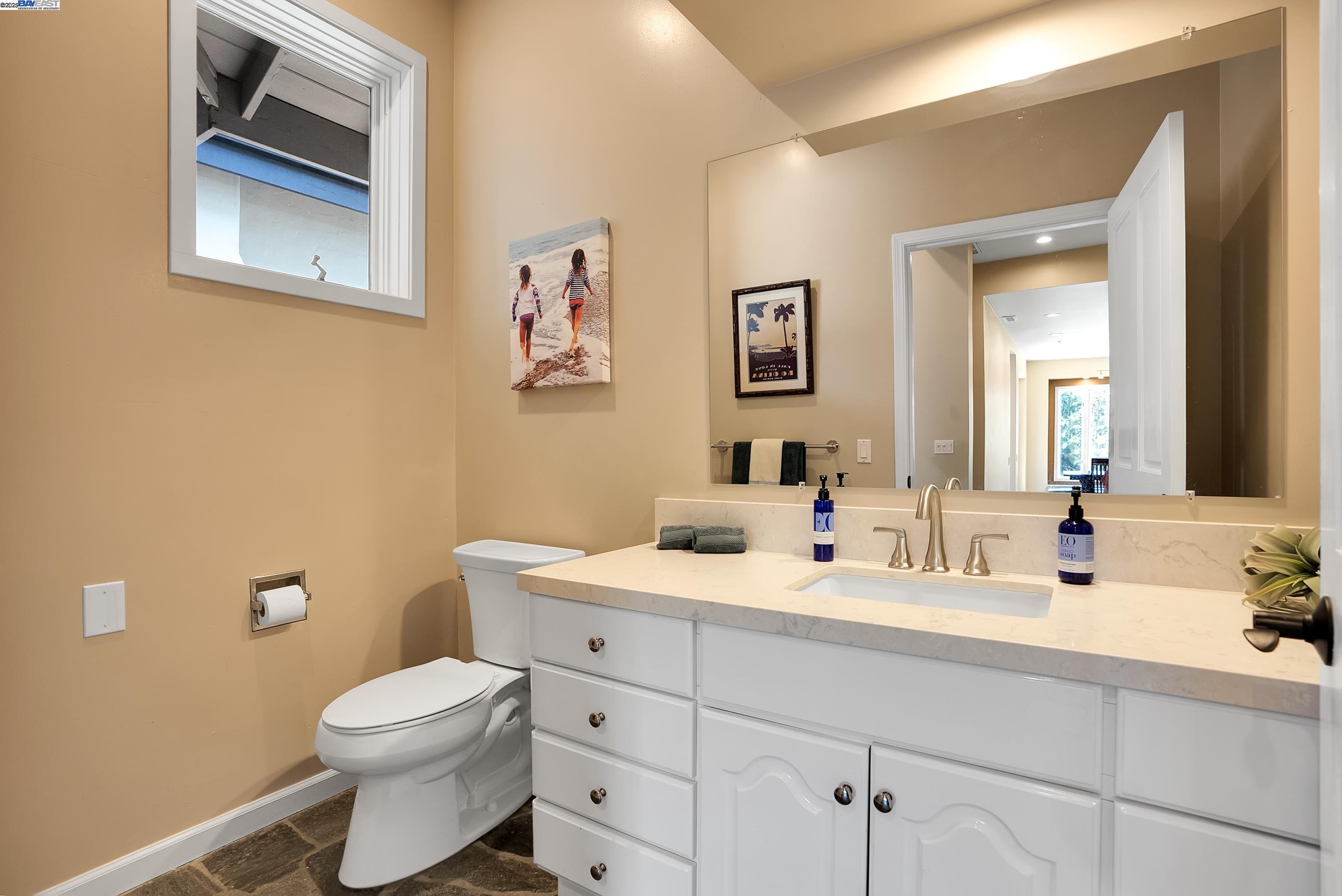 905 Moon Valley Ranch Road Watsonville, CA 95076 - Photo 36 of 60 a bathroom with a toilet sink and mirror