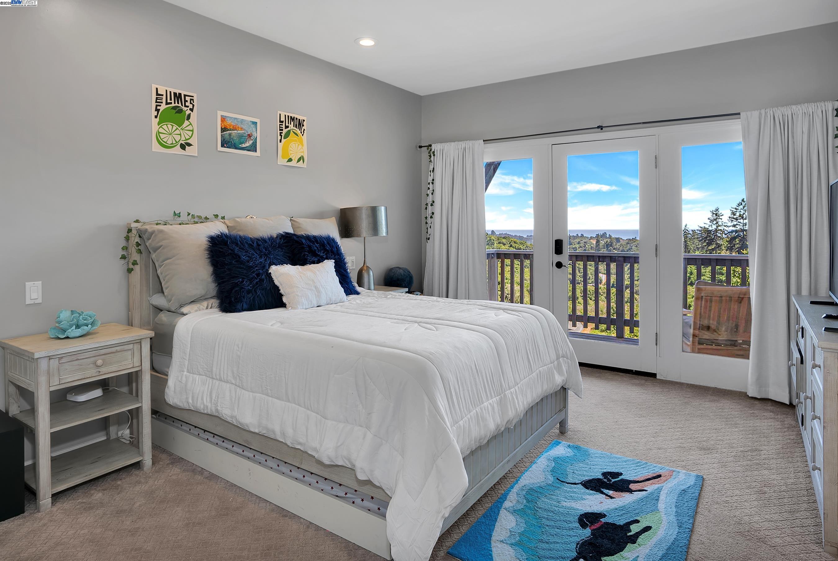 905 Moon Valley Ranch Road Watsonville, CA 95076 - Photo 43 of 60 a spacious bedroom with a bed and a large window