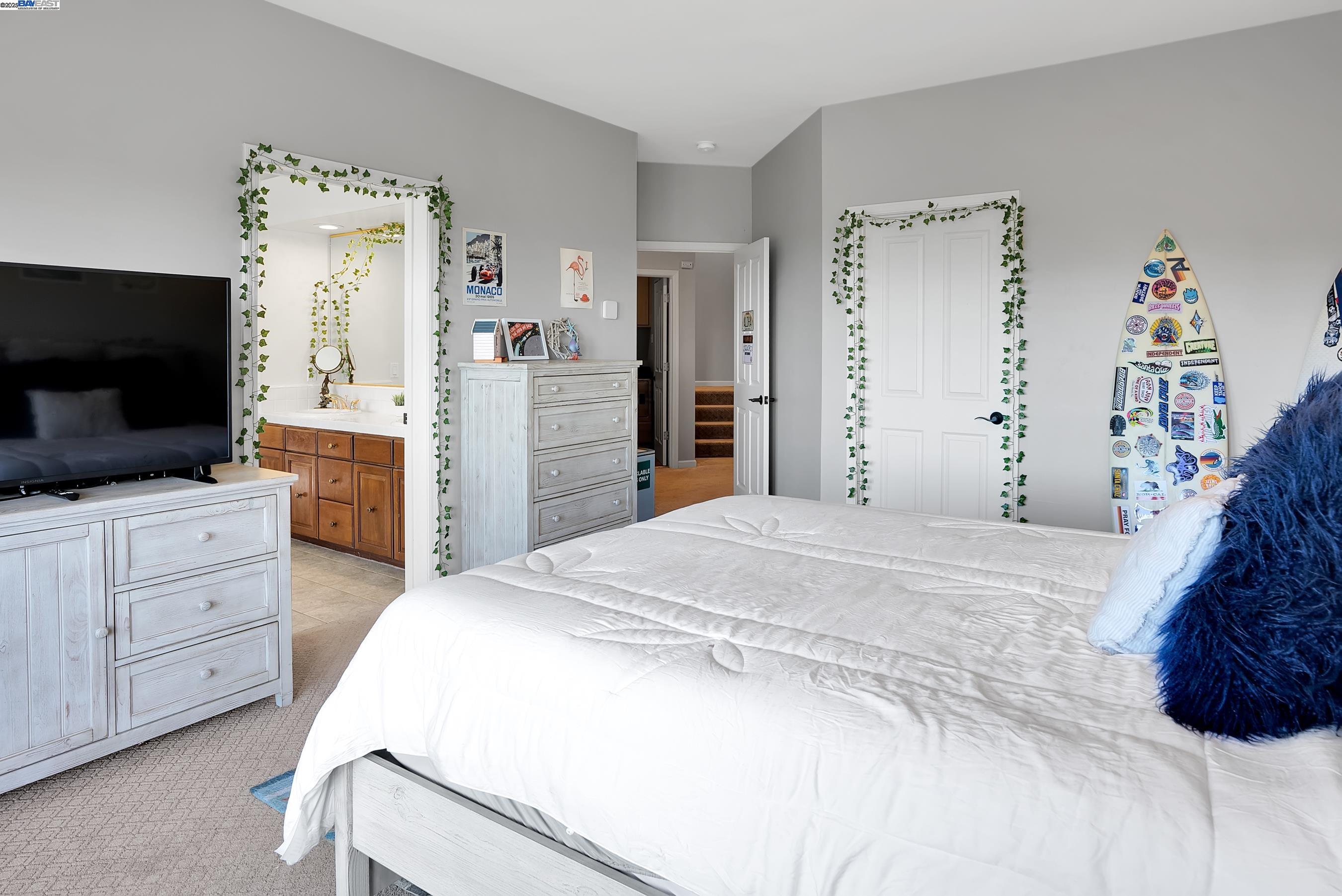 905 Moon Valley Ranch Road Watsonville, CA 95076 - Photo 44 of 60 a bedroom with a bed and a flat screen tv