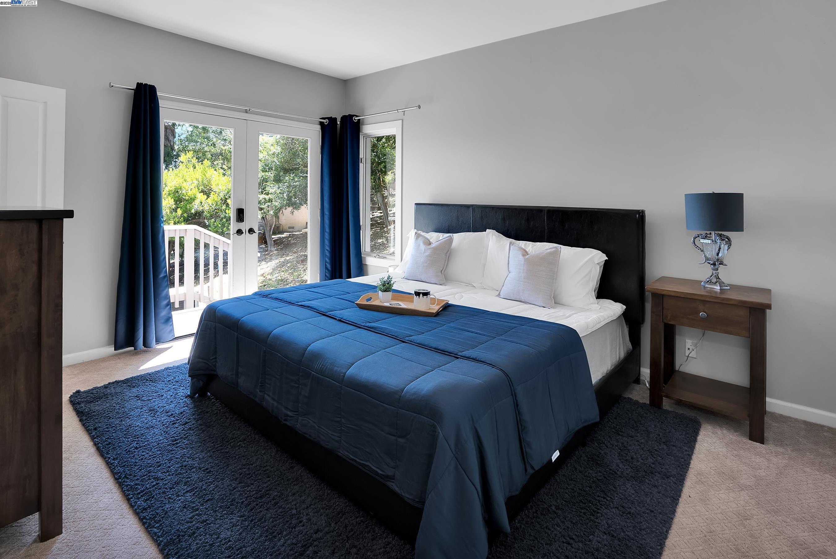 905 Moon Valley Ranch Road Watsonville, CA 95076 - Photo 46 of 60 a bedroom with a bed and wooden floor