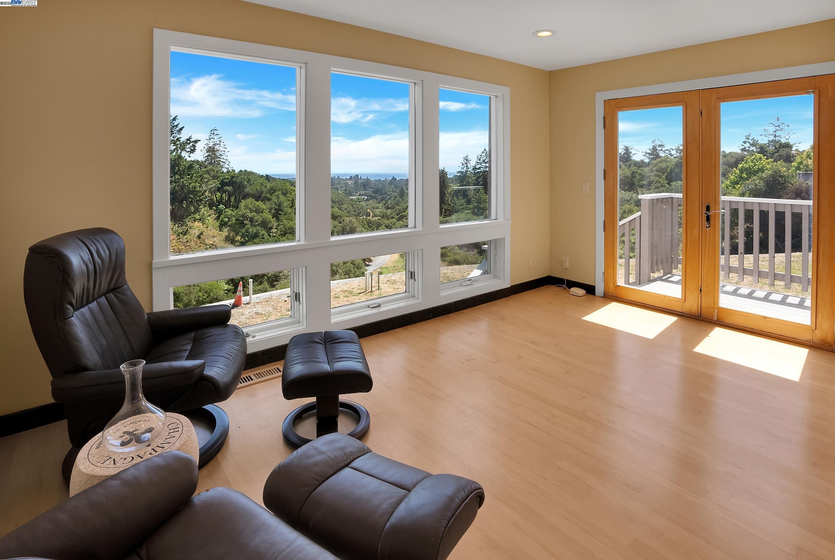 905 Moon Valley Ranch Road Watsonville, CA 95076 - Photo 53 of 60 a living room with furniture and a floor to ceiling window