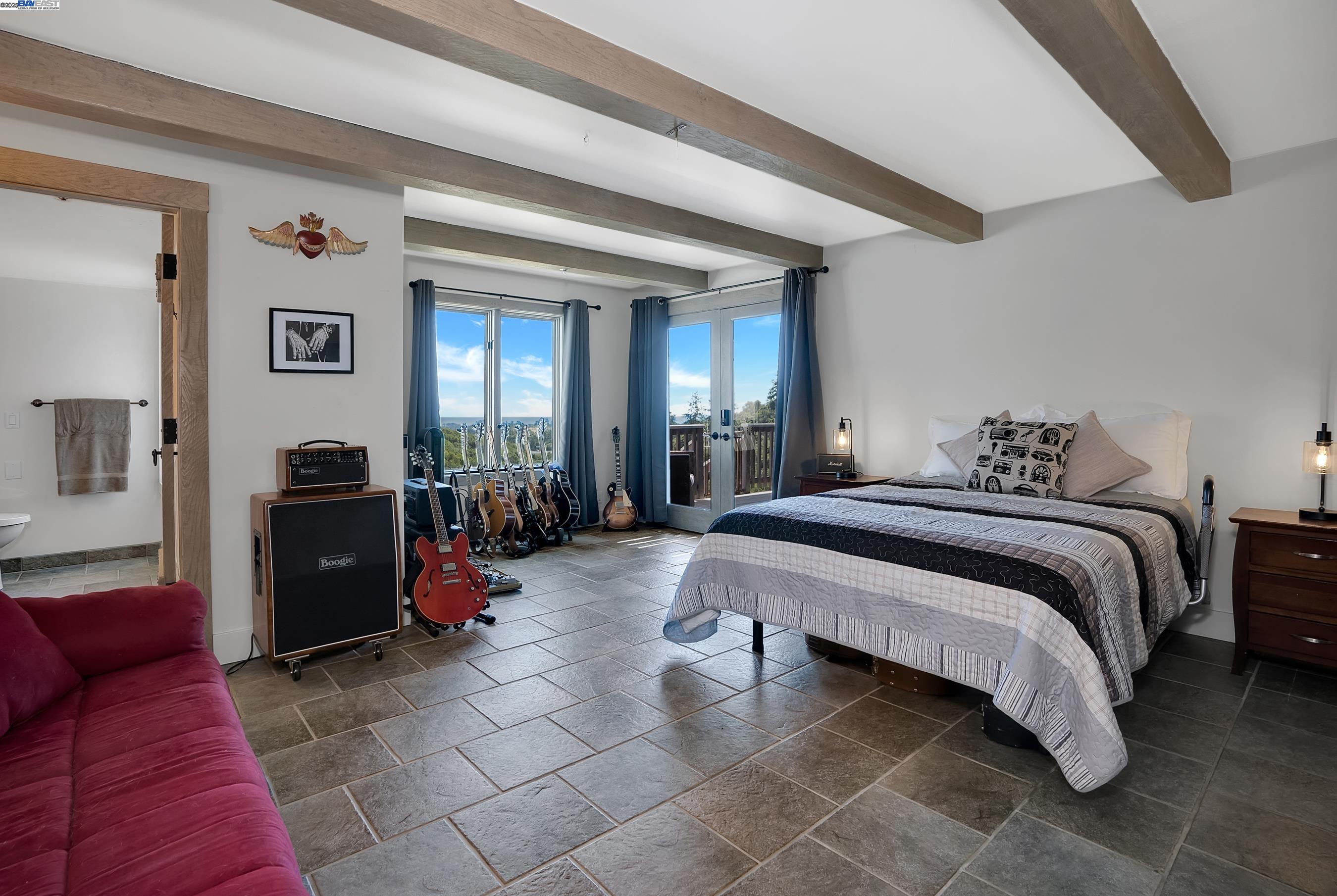 905 Moon Valley Ranch Road Watsonville, CA 95076 - Photo 55 of 60 a bedroom with a bed and a walk in closet