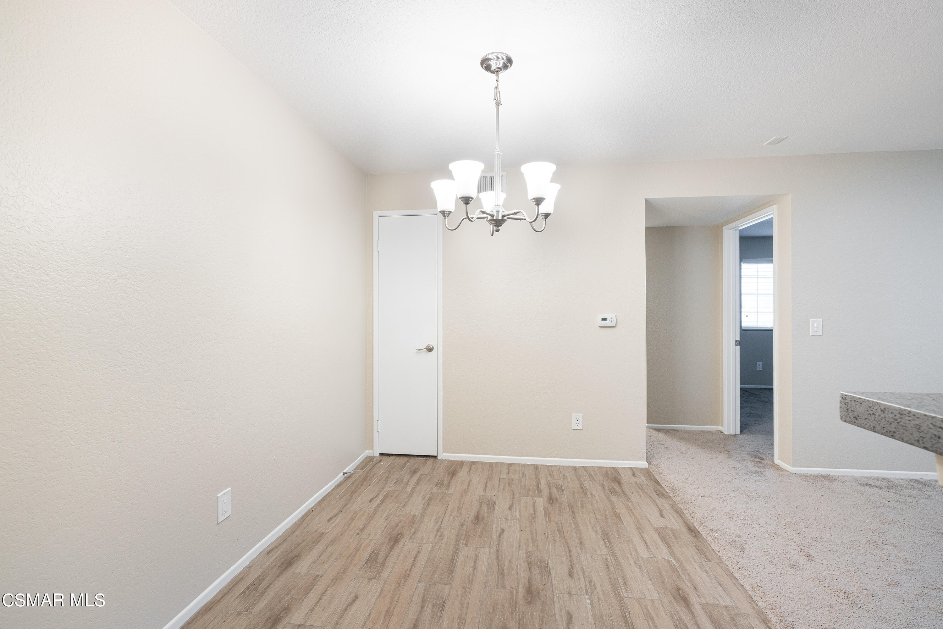 1125 Fitzgerald Road, Unit F Simi Valley, CA 93065 - Photo 12 of 25 wooden floor in a hall with an entryway