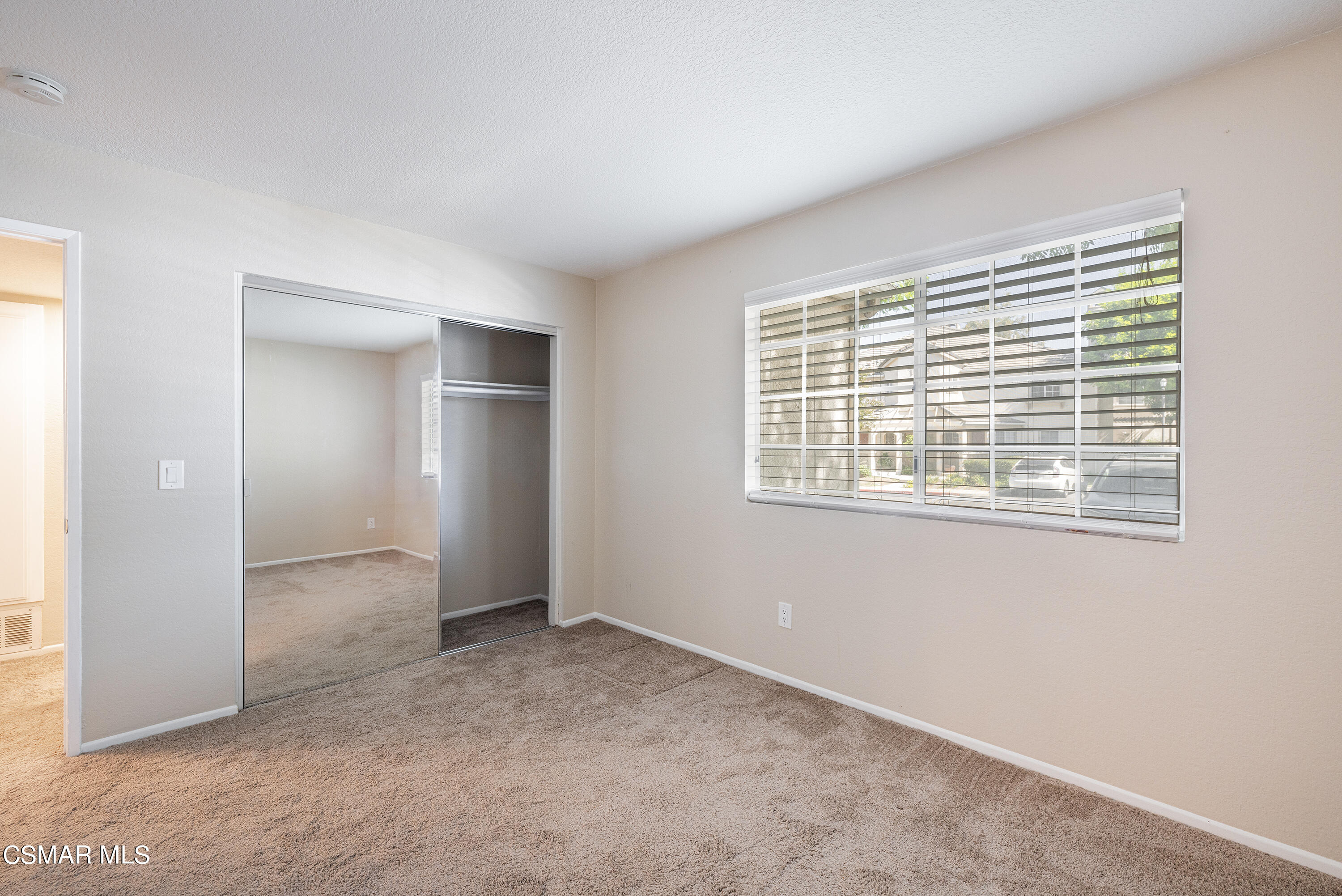 1125 Fitzgerald Road, Unit F Simi Valley, CA 93065 - Photo 22 of 25 a view of an empty room with a window