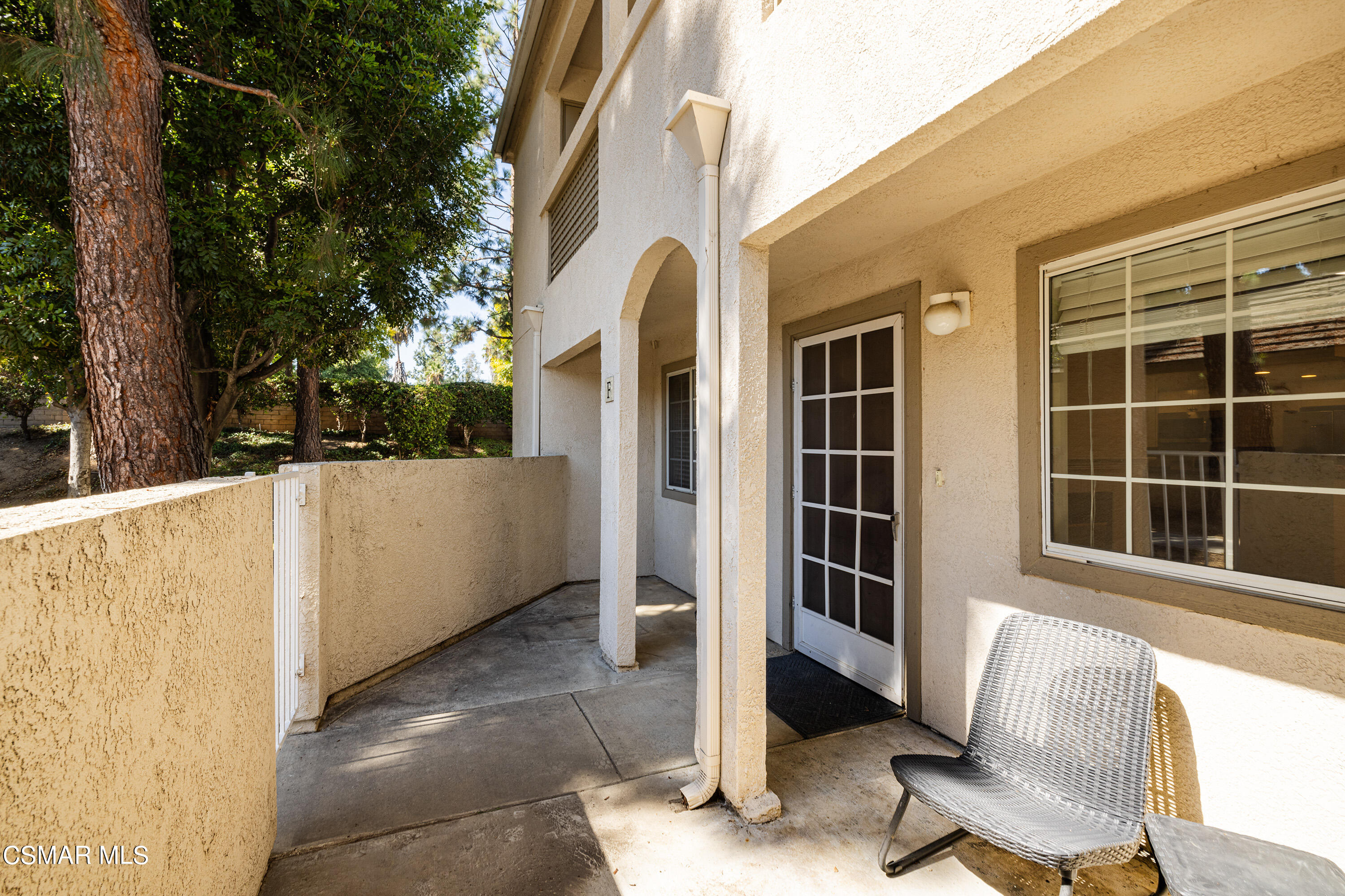 1125 Fitzgerald Road, Unit F Simi Valley, CA 93065 - Photo 6 of 25 a view of a balcony with chair and door