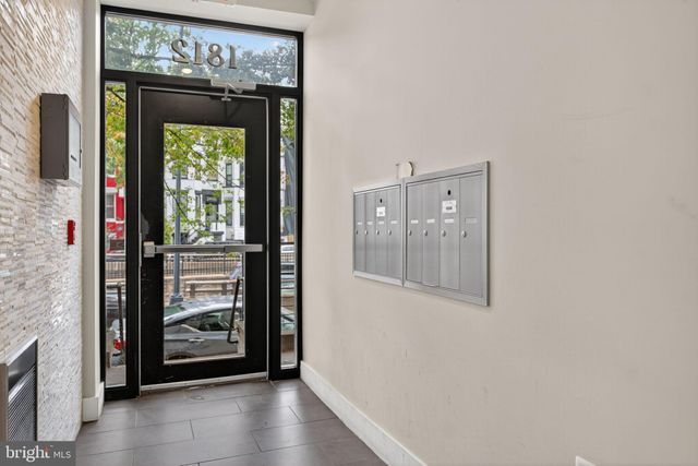 a view of an front door and a wooden floor