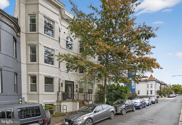 a view of a chairs and table in the patio