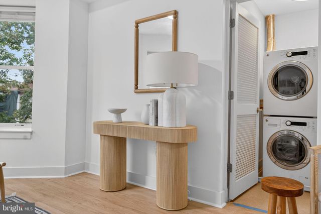 a view of a kitchen with washer and dryer