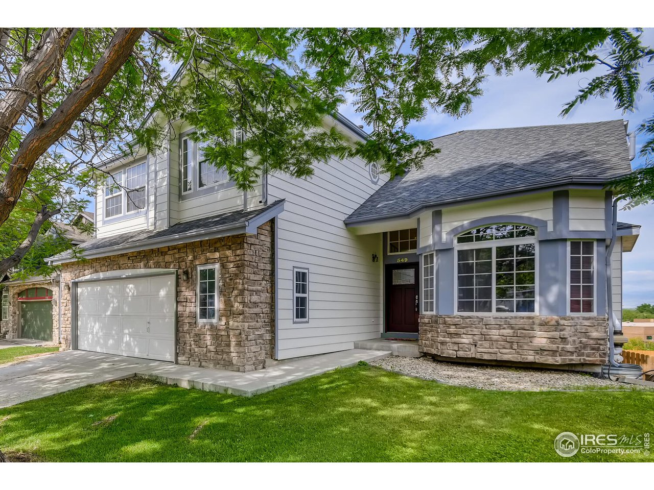 549 Rider Ridge Drive Longmont, CO 80504 - Photo 1 of 38 a view of a house with a garden