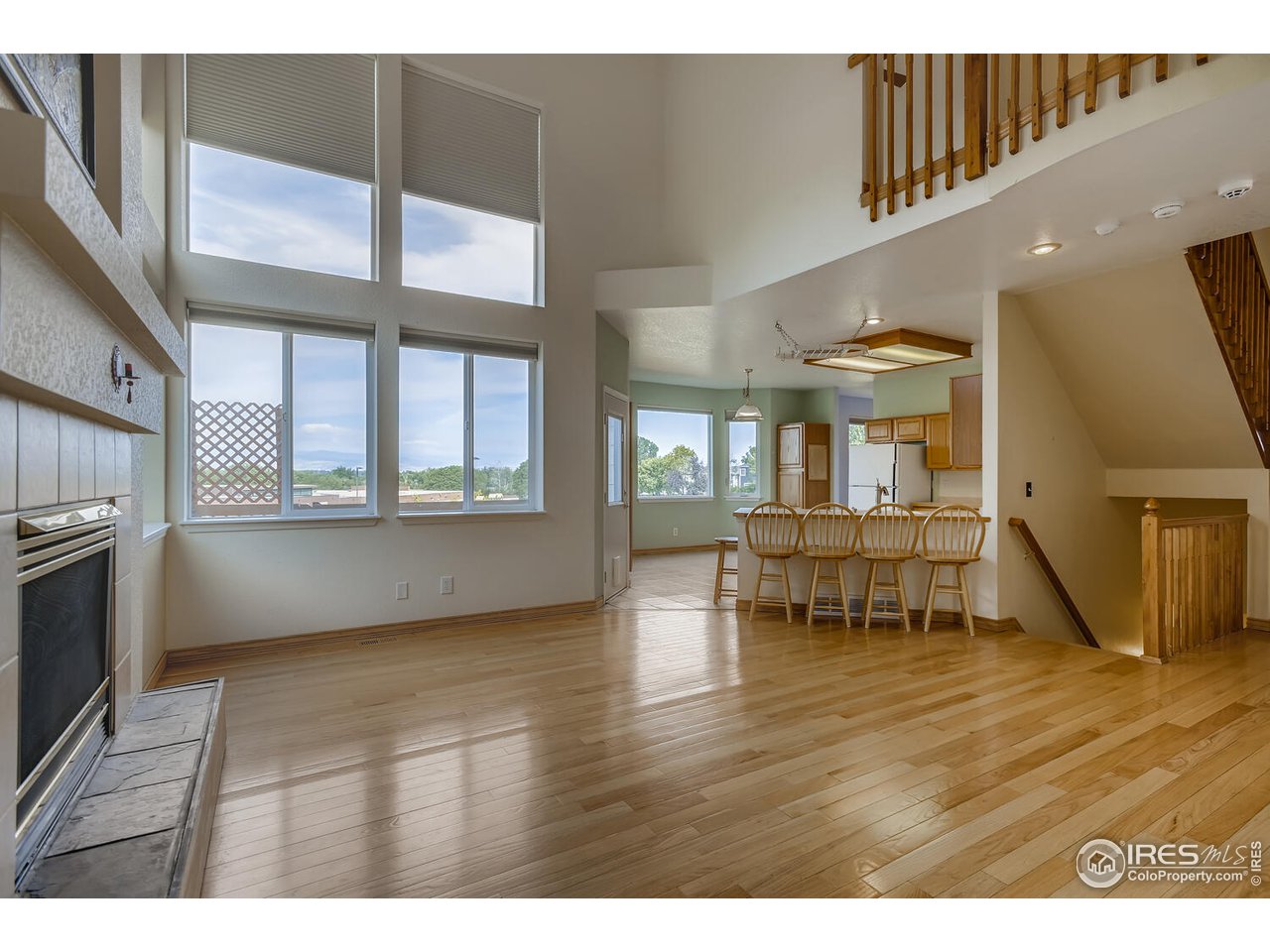 549 Rider Ridge Drive Longmont, CO 80504 - Photo 16 of 38 a view of an empty room with wooden floor
