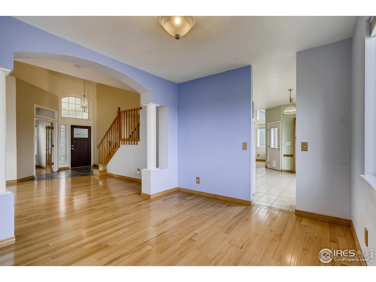 549 Rider Ridge Drive Longmont, CO 80504 - Photo 9 of 38 a view of an empty room with wooden floor and a window