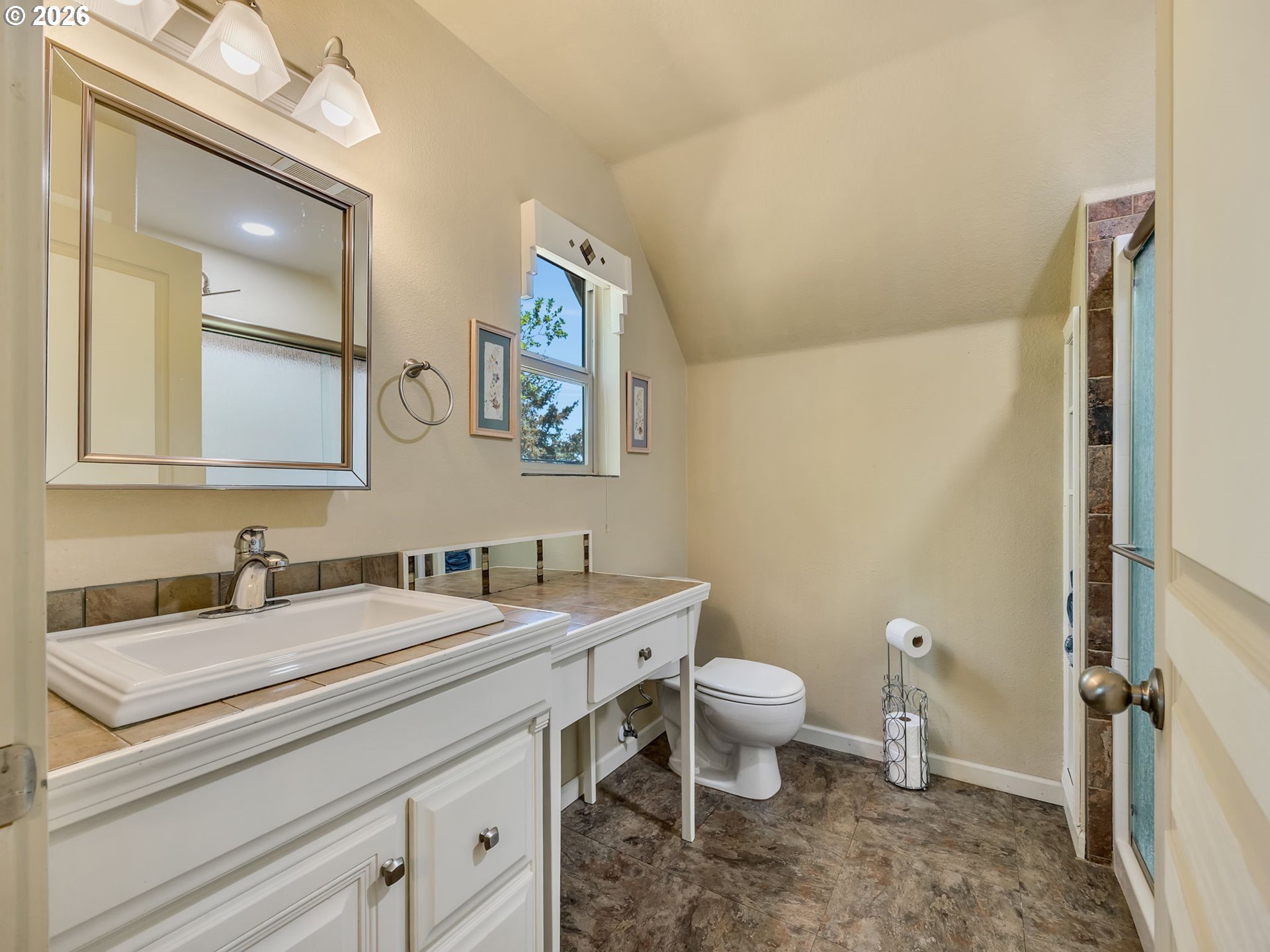 1077 Southwest Ridge Road Warrenton, OR 97146 - Photo 33 of 46 a bathroom with a toilet sink and mirror