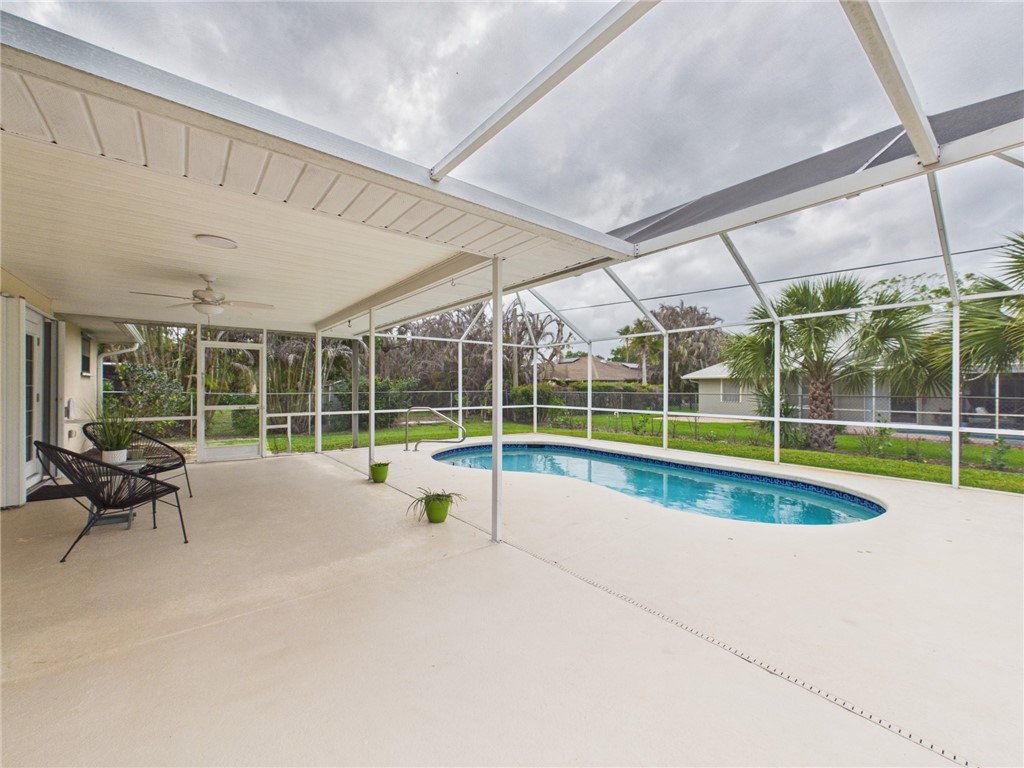 225 Midvale Terrace Sebastian, FL 32958 - Photo 25 of 25 a view of a swimming pool with a yard
