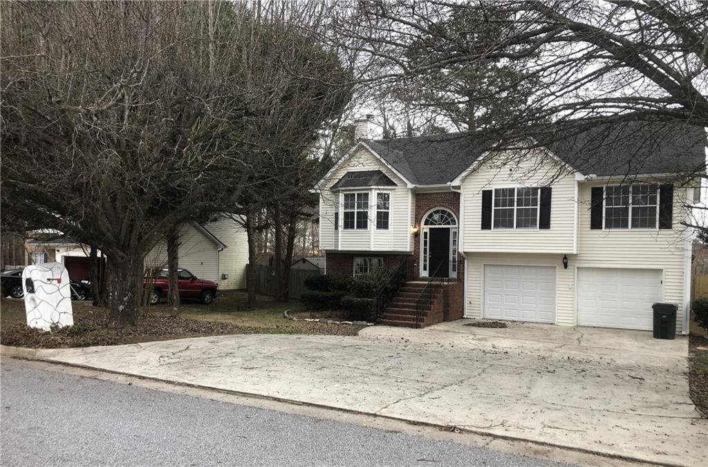 2700 Silver Queen Road Ellenwood, GA 30294 - Photo 1 of 1 a front view of a house with a yard