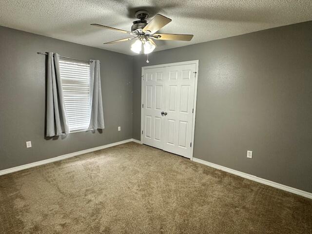 2155 Hagood Loop Crestview, FL 32536 - Photo 13 of 16 an empty room with windows and fan
