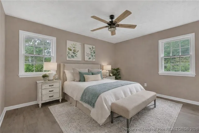 a bedroom with a large bed and a window