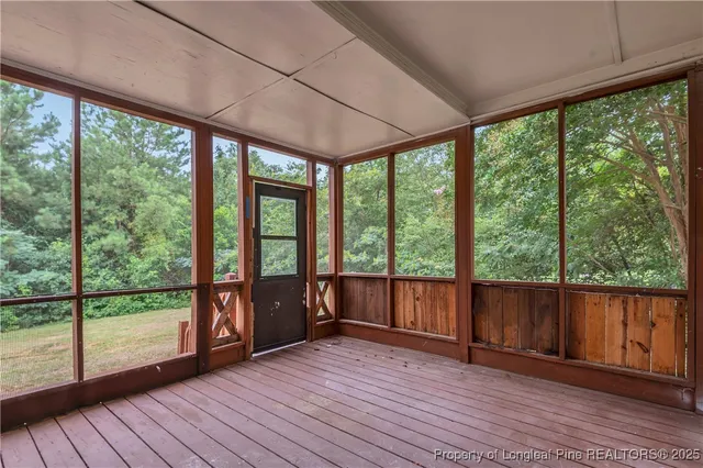 a view of a room with wooden floor and balcony