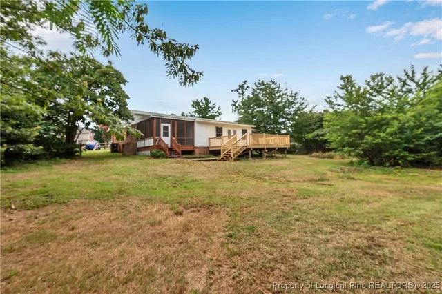 a view of a house with a big yard