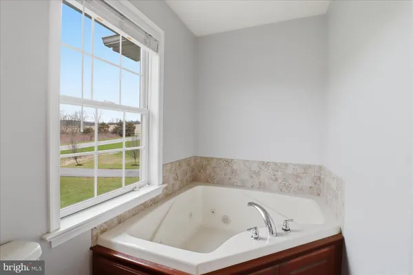 a bedroom with furniture and window