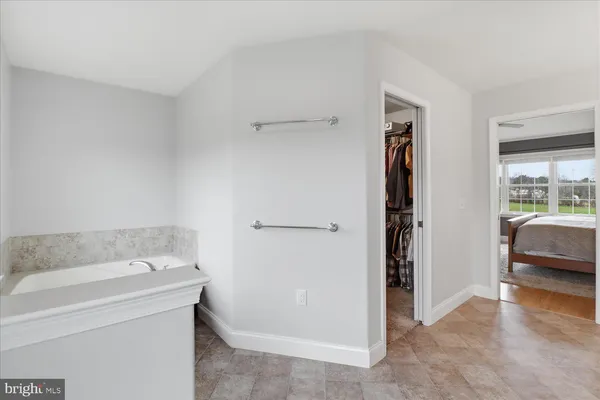 a bathroom with a double vanity sink mirror and toilet