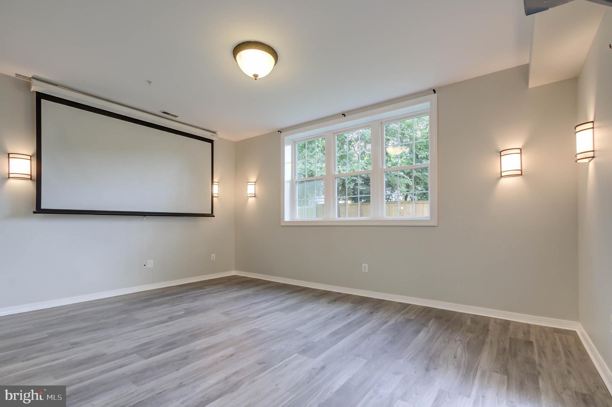 13832 Turnmore Road Silver Spring, MD 20906 - Photo 50 of 68 Theatre/ family room in the basement