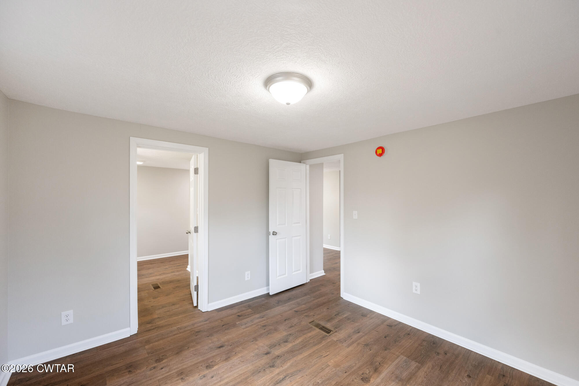 992 Greenway Road Huron, TN 38345 - Photo 12 of 17 a view of an empty room with wooden floor